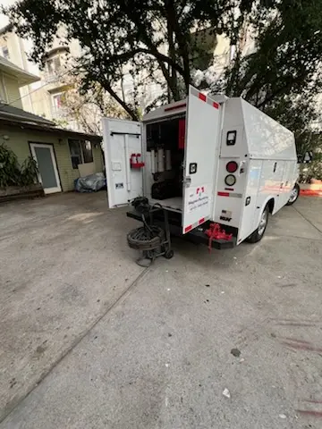 Magnet Plumbing service vehicle on-site for Grease Trap Cleaning in Paseo Pointe